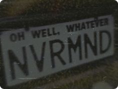 a close up of a street sign with grass in the background