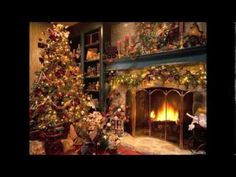 a decorated christmas tree sitting in front of a fireplace