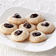 small cookies with chocolate filling on a white plate