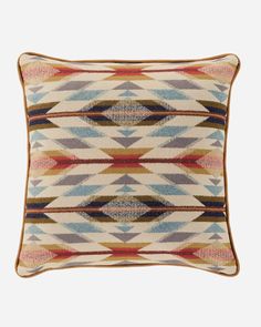 a multicolored pillow with an intricate design on the front and back, made from wool