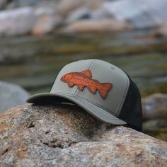 Custom Brook Trout Leather Patch Hat. This trucker style hat is perfect to add your personalized touch to. Choose from our variety of hat color and leather color options. Fish patch engraved into our high quality leather patch hat. PRODUCT DETAILS -------------------------- ~ Richardson 112 trucker style snapback hats ~ Brook Trout on our high quality 100% genuine leather patch hats ~ Hat Color Options: Black, Navy, Heather Gray / Black, Charcoal / White, Navy / White, Charcoal / Black, Black / Brown Trucker Hat With Short Brim For Outdoor Activities, Adjustable Flat Brim Trucker Hat For Fishing, Outdoor Trucker Hat With Leather Patch And Short Brim, Curved Brim Trucker Hat For Fishing, Trucker Baseball Cap For Fishing, Brown Snapback Fishing Hat, Brown Snapback Hat For Fishing, Casual Brown Hats For Fishing, Brown Fishing Cap