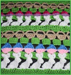 a crocheted blanket is shown with different colors and designs on the edges, including pink, blue, green, and white