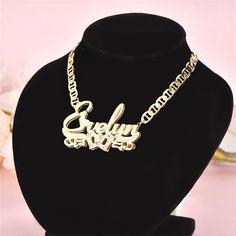 Elevate your jewelry collection with our exquisite Real 18K Gold Filled Stainless Steel Name Necklace. Crafted with care and attention to detail, this necklace is the perfect personalized accessory to showcase your individuality and style. Featuring a durable stainless steel base that is expertly plated with real 18K gold, this necklace offers a luxurious and timeless appeal. The gold filling ensures a lasting shine and luster, making it a jewelry piece that can be cherished for years to come. The centerpiece of this necklace is the birthstone nameplate, adding a touch of elegance and personalization. Each nameplate is meticulously crafted to showcase your chosen name, making it a truly unique and meaningful gift for yourself or a loved one. Not only does this necklace boast exceptional be Luxury Rose Gold Nameplate Jewelry, Affordable Nameplate Necklace With Letter Print, Luxury Nameplate Jewelry, Luxury Nameplate Fine Jewelry, Luxury Diamond Nameplate Necklace Gift, Intertwined Hearts, Name Plate Necklace, 3d Name, Pink Zircon