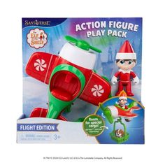 an action figure plays pack with a toy airplane and elf hat on it's head