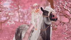 a woman riding on the back of a horse through a forest filled with pink flowers