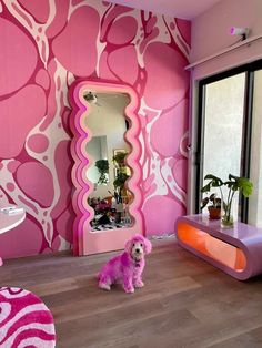 a pink dog sits in the middle of a room with an unusual wallpaper design