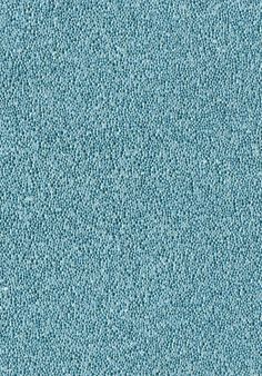 a blue carpet textured with small dots