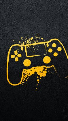 a game controller painted on the side of a road with yellow paint splatters