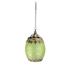 a green glass lamp hanging from a chain on a white background with an ornate design