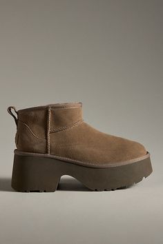 Sheepskin upper, insole Sugarcane EVA sole Pull-on styling Imported | Classic Ultra Mini New Heights Boots by UGG in Brown, Women's, Size: 9, EVA at Anthropologie Ugg Mini Or Short, Ugg Classic Mini Brown, Ugg Classic Mini Ii Brown, Ugg Ultra Mini Shine, Camel Chunky Boots, Classic Mini Regenerate Ugg, Short Tan Ugg Boots, Ugg Classic Ultra Mini Burnt Cedar, Ugg Classic Ultra Mini Burnt Olive