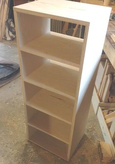 an unfinished bookcase in the process of being built