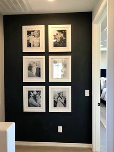 black and white photos are hung on the wall