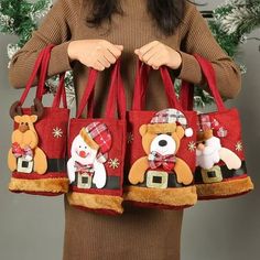 a woman holding two christmas themed bags with teddy bears on the front and back,