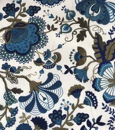 a blue and brown floral design on white fabric