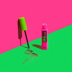 a pink and green background with a tube of toothpaste next to a brush