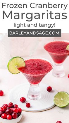 frozen cranberry margaritas with lime and tangerine garnish on top