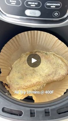 an air fryer with some food inside of it