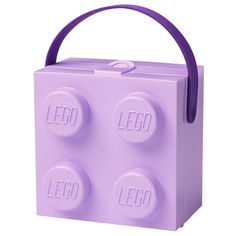 a purple lego lunch box with handle and two round holes on the front that say'lego '