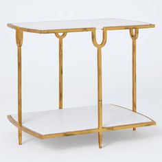 a gold and white side table with two shelves