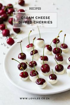 small cherries on a white plate with text overlay that reads cream cheese dipped cherries