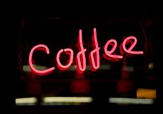 a neon sign that says coffee on it