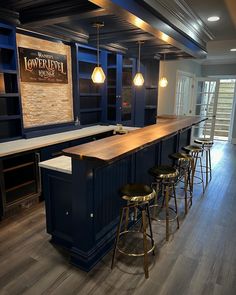 an empty bar with stools in the middle