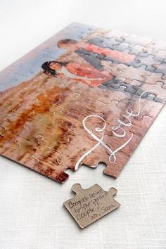 a puzzle piece with the word love on it next to a couple's wedding photo