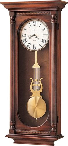 a wooden clock with roman numerals and a pendulum on the front, in an antique style