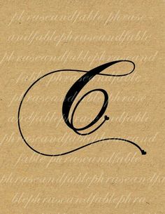 the letter g is written in cursive writing on a piece of brown paper