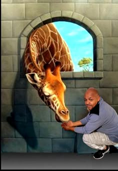 a man kneeling down in front of a painting of a giraffe