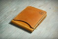 a wallet sitting on top of a wooden table