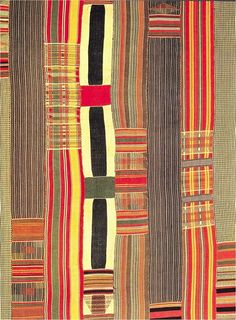 an old rug with different colored stripes on it