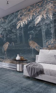 a living room with a couch, coffee table and wallpaper that has birds on it