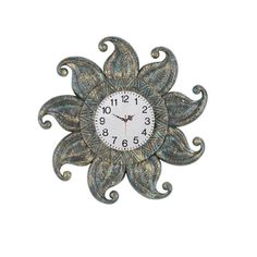 a wall clock with an intricate design on it