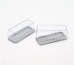 two clear plastic containers with dividers on white background