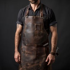 The Leather Apron for Blacksmithing: a symbol of tradition, craftsmanship, and resilience in the forge! Crafted with precision and passion, our apron is designed to meet the rigorous demands of blacksmithing while exuding timeless style. Blacksmith Clothes, Blacksmith Costume, Blacksmith Apron, Medieval Blacksmith, Welding Apron, Butcher Apron, Art Apron, Blacksmith Forge, Blacksmith Tools