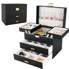 three drawers with jewelry in them are open