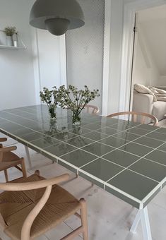 a glass table with chairs around it