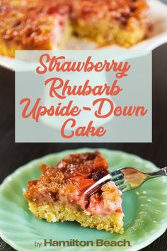 strawberry rhubarb upside down cake on a green plate with a fork in it