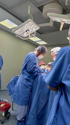 doctors performing surgery in an operating room