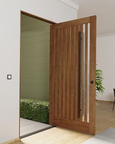 an open wooden door leading to a dining room with green plants on the floor and a black table