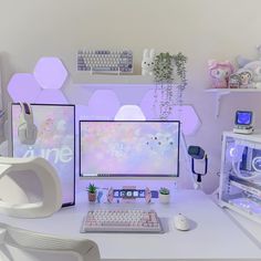 a white desk with a computer monitor and keyboard