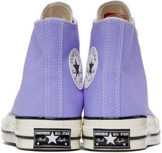 High-top cotton canvas sneakers in purple. · Round rubber cap toe · Lace-up closure · Eyelet vents at inner side · Logo patch at inner side · Rubberized logo patch at heel · Ortholite® insole · Treaded rubber sole · Contrast stitching in white Supplier color: Ultraviolet/White/Black All Stars Converse, Vintage Sneakers, Chuck 70, Converse Sneakers, Mens Sportswear, Sneaker Collection, Canvas Sneakers, Converse All Star, Sneakers For Sale