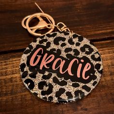 a leopard print keychain with the word gracie in pink on it