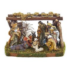 a nativity scene with figurines and animals