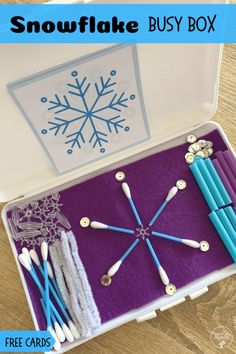 the snowflake busy box is filled with crafting supplies