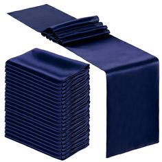 a stack of folded blue napkins sitting on top of each other