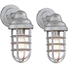 The Marlowe collection of outdoor lighting offers a creative combination of nautical style and industrial design. This set of two metal outdoor wall lights features a stylish cage design with a narrow glass shade inside. The steel construction is made to look galvanized for an urban-rustic look. Perfect for a patio space or garage area, these versatile fixtures can be installed pointing up or down. Industrial Outdoor, Deck House, Outdoor Wall Light Fixtures, Outdoor Party Lighting, Steel Cage, House Yard, House Deck, Urban Rustic, House With Porch