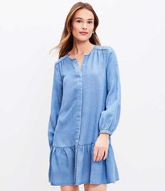 As modern-minimalist as it is flirty-femme, this fluid woven chambray dress swirls and twirls with a flouncy dropped waist. Split neck. Hidden button front. Long blouson sleeves with button cuffs.,Hit:Hit: Mini - Hits above the knee,Imported:Imported,Fit:Fit: Swing - fits loose and swingy,Length:33 3/4" from top back neck to hem, measured from a size 8/M,Fabrication:60% Lyocell 20% Linen 20% Polyester,Garment Care:Machine Washable Loft Petite Chambray Flounce Dress Size XS Mezzo Blue Wash Women' Long Sleeve Chambray Dress, Denim Dress Fall, Denim Chambray Dress, Chambray Shirt Dress, Flounce Dress, Womens Denim Dress, Tall Dresses, Flounced Dress, Chambray Dress