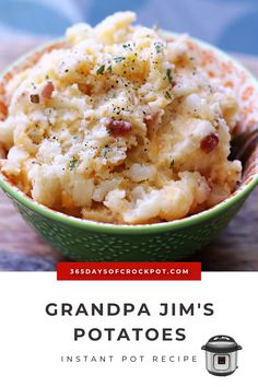 a green bowl filled with mashed potatoes on top of a wooden table